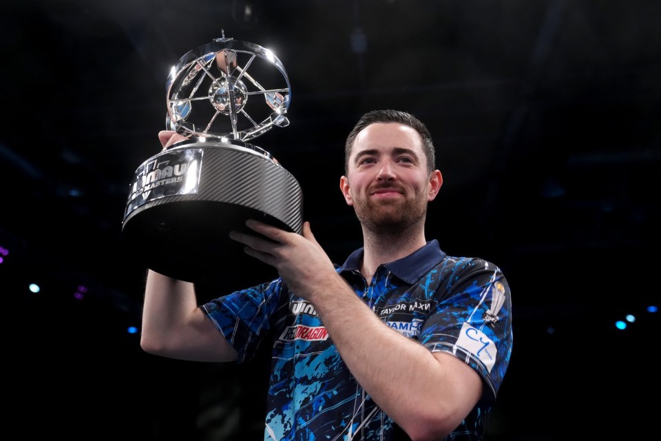 Luke Humphries with his trophy after winning against Jonny Clayton in the final of the 2025 Winmau World Masters at the Marshall Arena, Milton Keynes. Picture date: Sunday February 2, 2025. PA Photo. See PA story DARTS Masters. Photo credit should read: Bradley Collyer/PA Wire. RESTRICTIONS: Use subject to restrictions. Editorial use only, no commercial use without prior consent from rights holder.