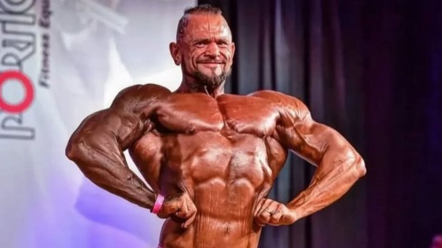 Bodybuilder posing on stage.