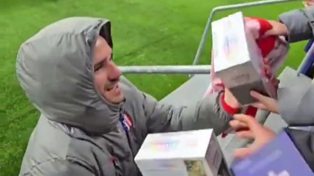 A man receives gifts from fans.