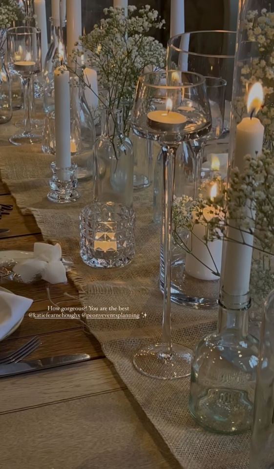 Table setting with candles and flowers.