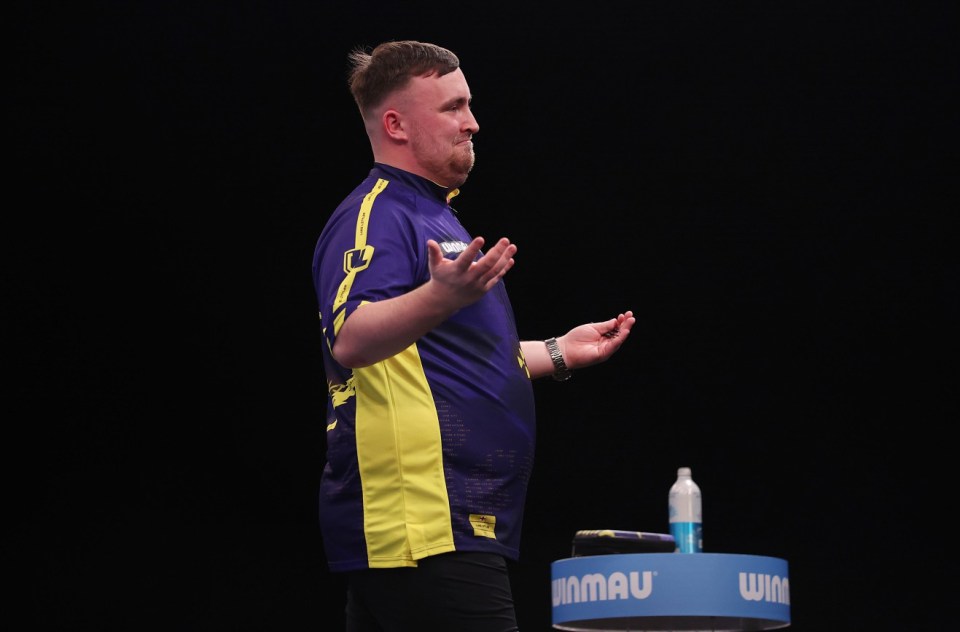 MILTON KEYNES, ENGLAND - FEBRUARY 02: Luke Littler of England reacts during the quarter-finals of the 2025 Winmau World Masters at Marshall Arena on February 02, 2025 in Milton Keynes, England. (Photo by Harry Murphy/Getty Images)