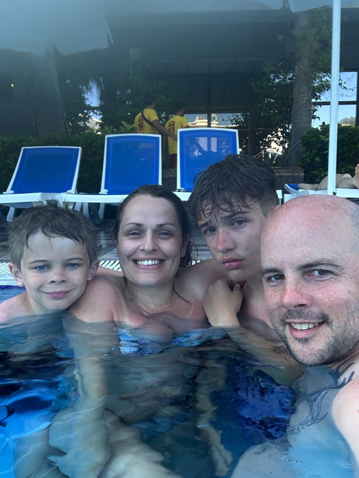 Family in a swimming pool.