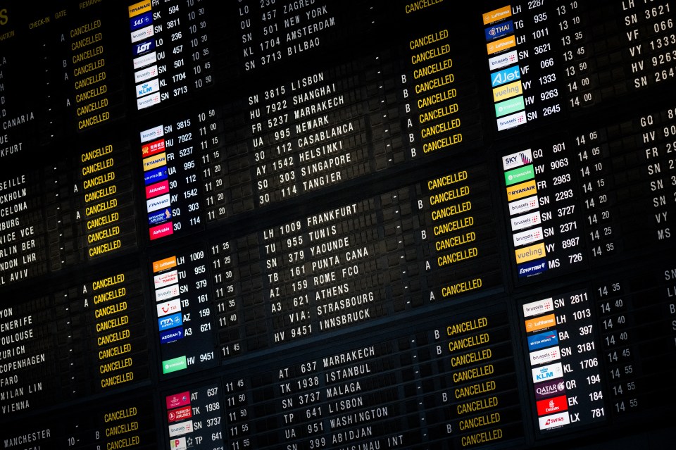 This photograph shows an information board reading cancelled flights, amid a strike action at Brussels Airport as part of a day of actions against the new government declaration, in Zaventem near Brussels on February 13, 2025. (Photo by JASPER JACOBS / Belga / AFP) / Belgium OUT (Photo by JASPER JACOBS/Belga/AFP via Getty Images)