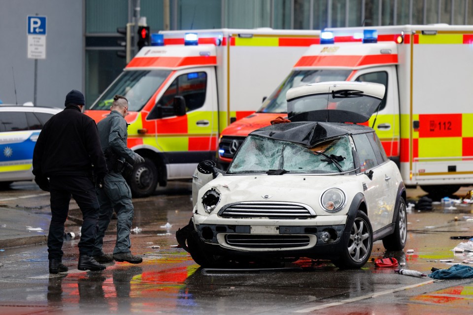 Members of the emergengy services work at the scene where a car drove into a crowd in the southern German city of Munich on February 13, 2025 leaving several people injured, police said. Munich police said on social media platform X that "several people were injured" after "a car drove into a group of people" in the centre of the Bavarian state capital. (Photo by Michaela STACHE / AFP) (Photo by MICHAELA STACHE/AFP via Getty Images)