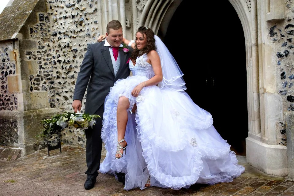 Newlyweds leaving a church.