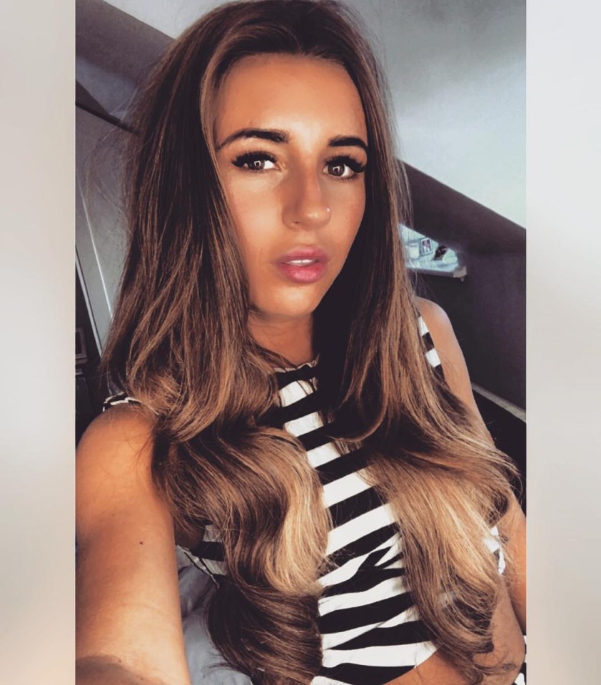 Self-portrait of Dani Dyer with long brown hair wearing a black and white striped top.