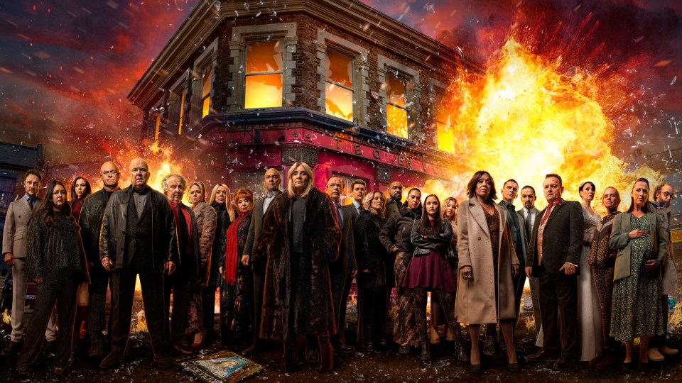 EastEnders cast in front of a burning pub.