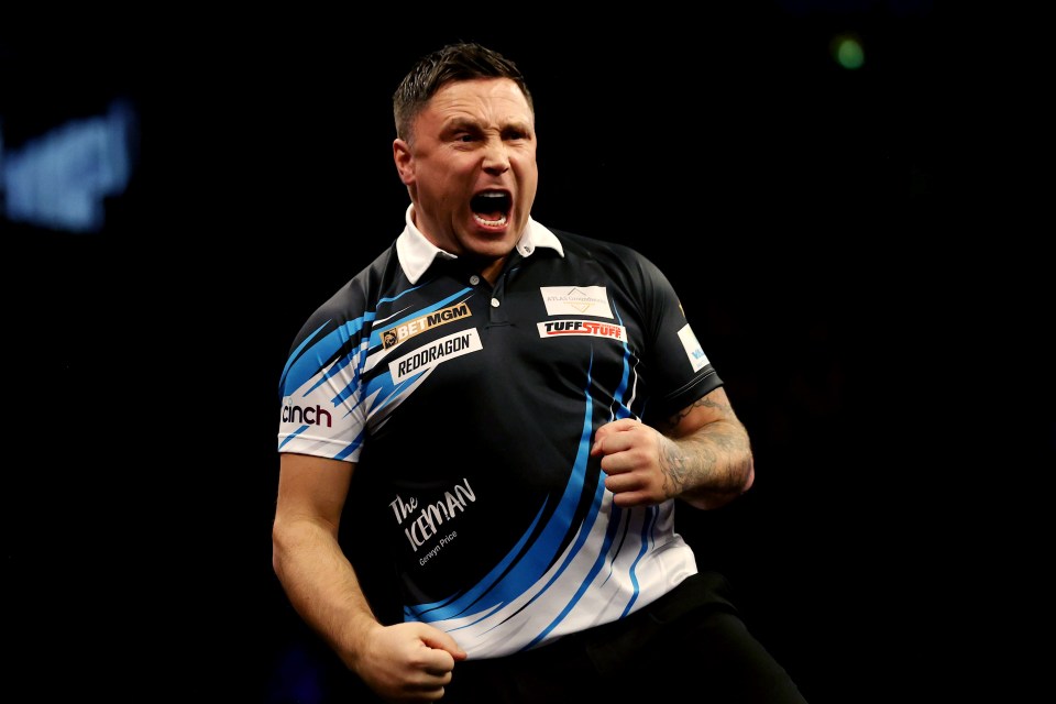 Gerwyn Price celebrating during a darts match.