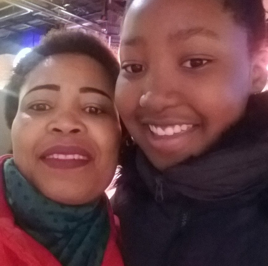 Selfie of two women smiling.