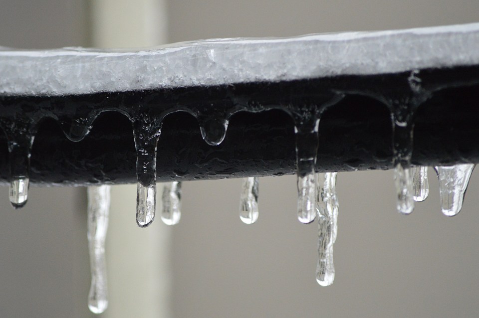 Icicles forming on a pipe.