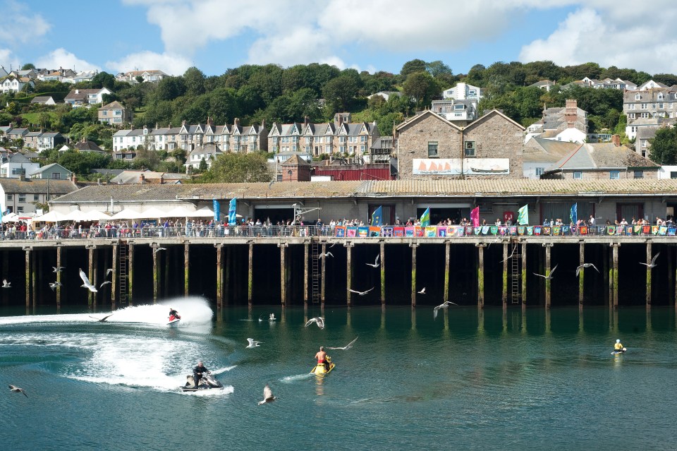 Jet skiers and seagulls at a Newlyn fish festival.