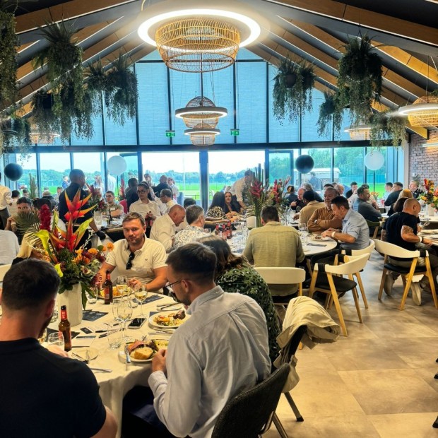 A large group of people dining in a restaurant.