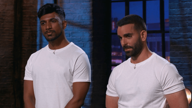 Two men in white t-shirts.