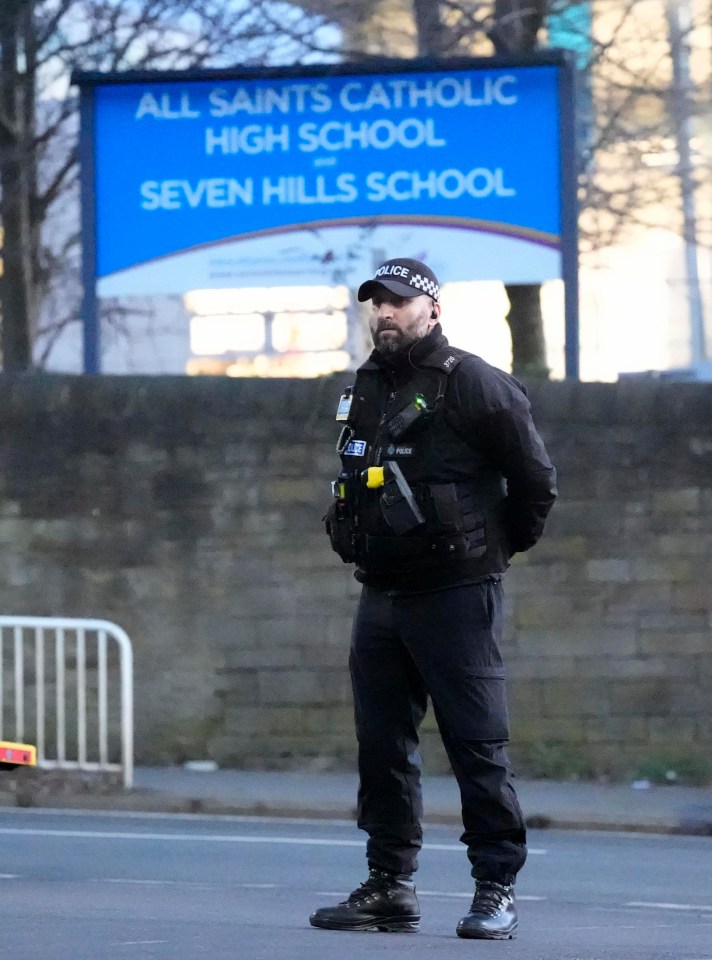 A police officer outside All Saints Catholic High School, on Granville Road in Sheffield, South Yorkshire, after a 15-year-old boy died following a stabbing incident at the school. Picture date: Monday February 3, 2025. PA Photo. See PA story POLICE Sheffield. Photo credit should read: Danny Lawson/PA Wire