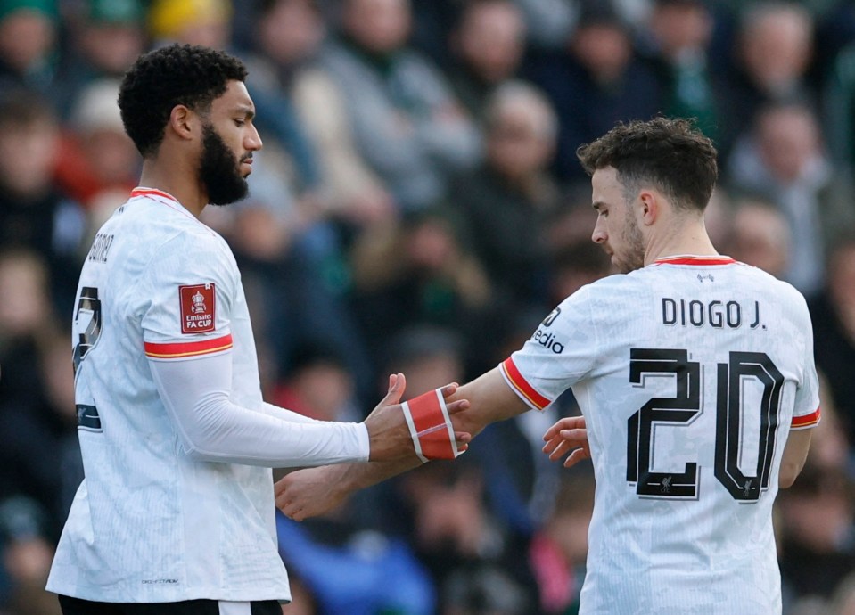 Soccer Football - FA Cup - Fourth Round - Plymouth Argyle v Liverpool - Home Park, Plymouth, Britain - February 9, 2025 Liverpool's Joe Gomez gives the captain's armband to Diogo Jota as he walks off the pitch after sustaining an injury Action Images via Reuters/Peter Cziborra