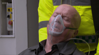 Man receiving oxygen through a mask.