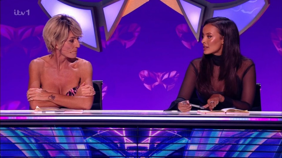 Screenshot of two women sitting at a judging table.