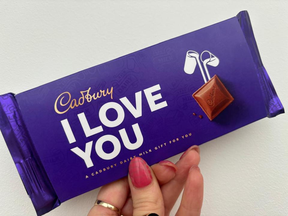 Cadbury Dairy Milk chocolate bar that says "I LOVE YOU".