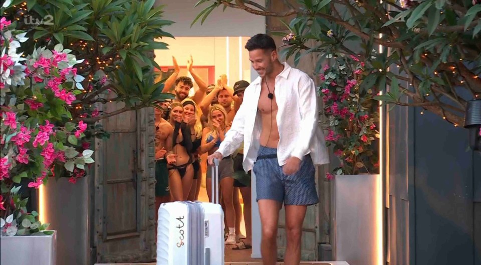 Scott Thomas leaving the Love Island villa, saying goodbye to the other islanders.