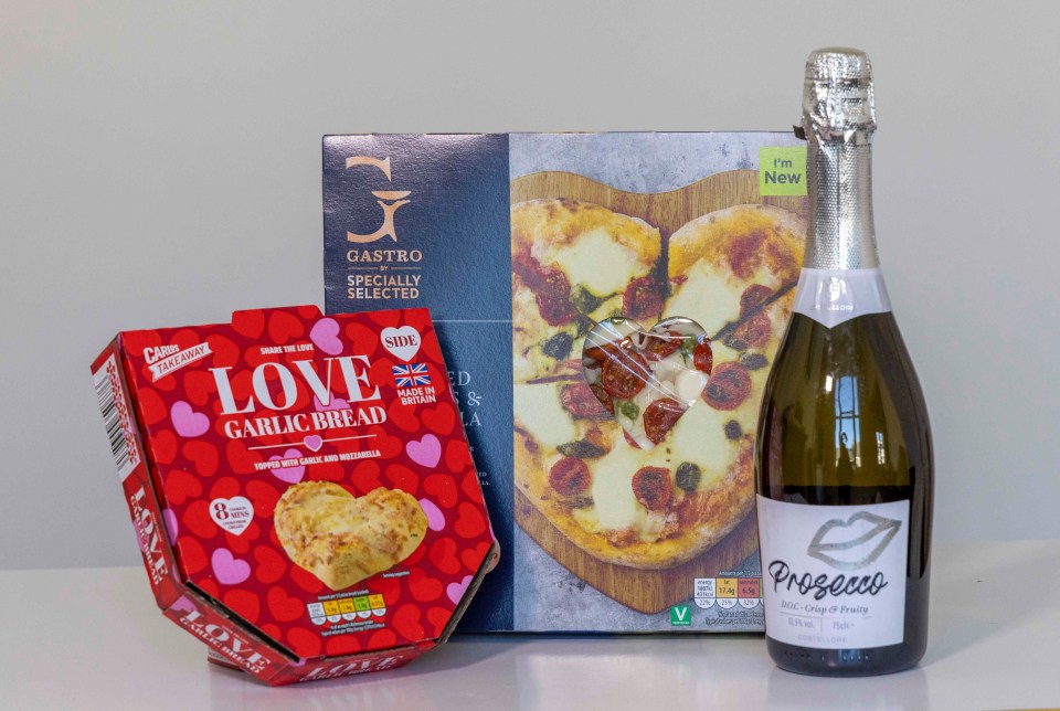 Valentine's Day dinner: heart-shaped pizza, garlic bread, and Prosecco.