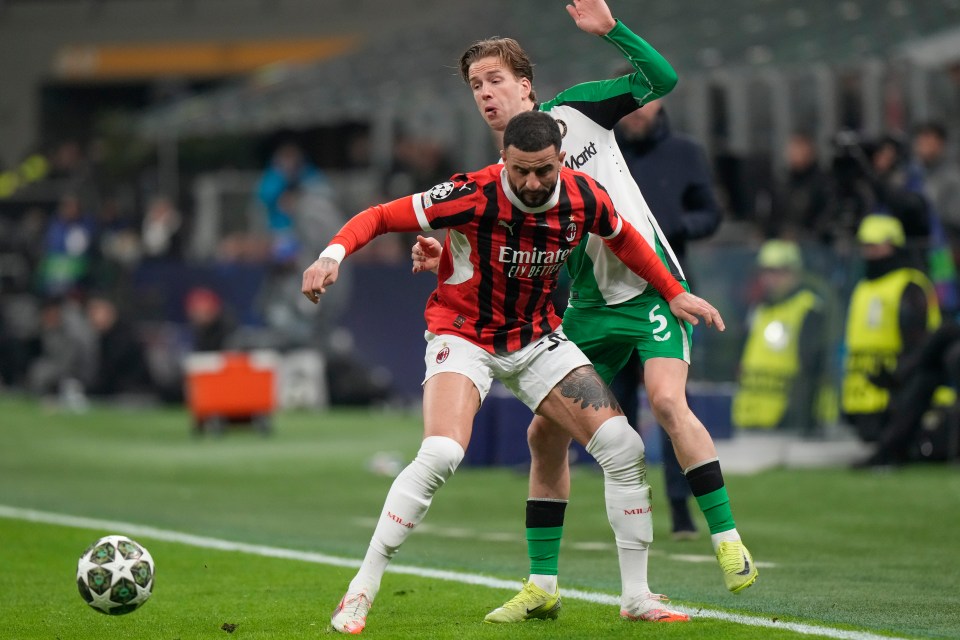 AC Milan's Kyle Walker vying for the ball with Feyenoord's Gijs Smal.