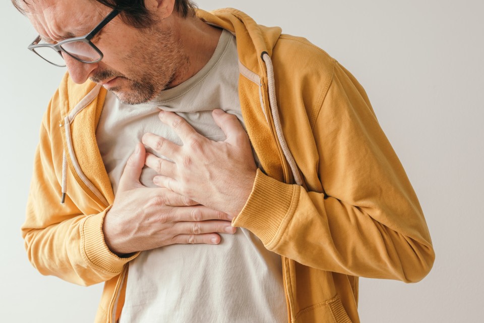 Man experiencing chest pain.