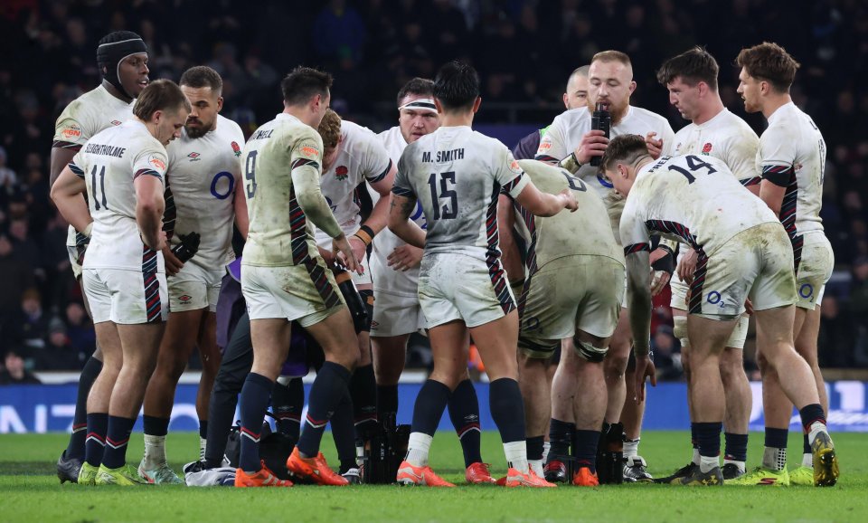 England rugby team huddle.