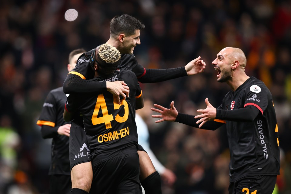 Galatasaray players celebrating a goal.