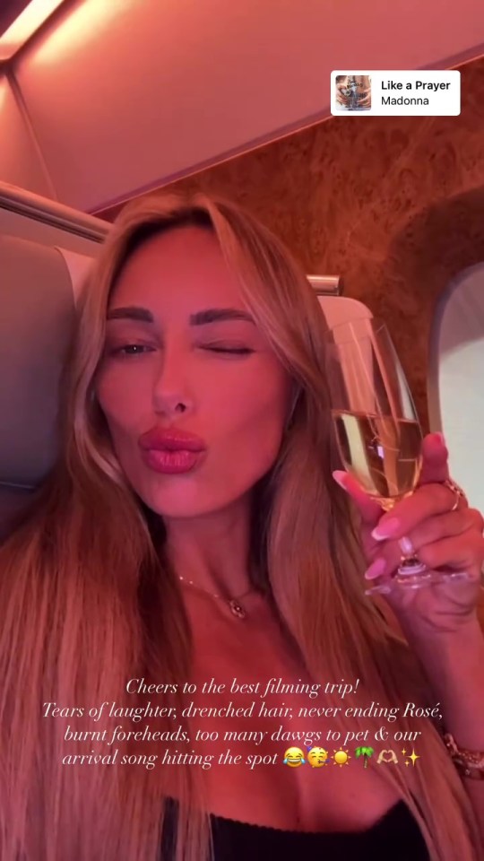 Amber Turner celebrating a filming trip with champagne.