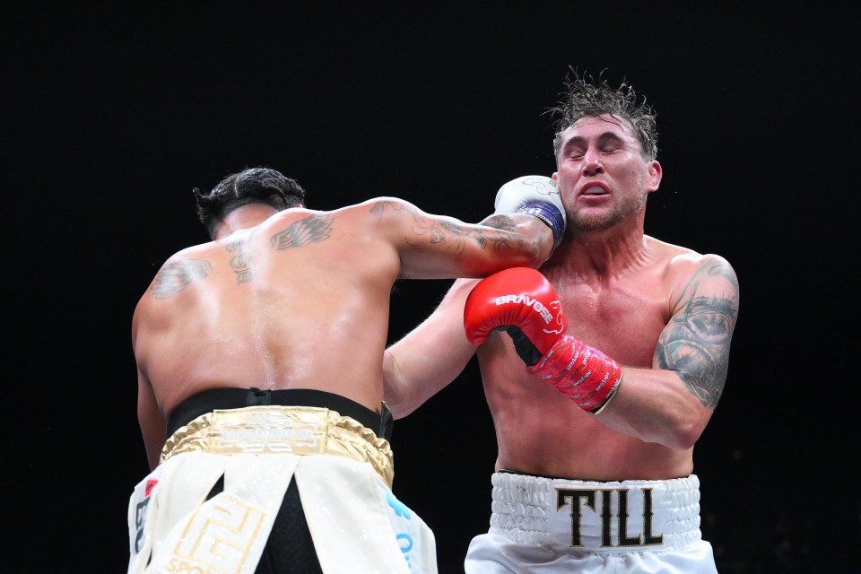 Anthony Taylor punches Darren Till in a boxing match.