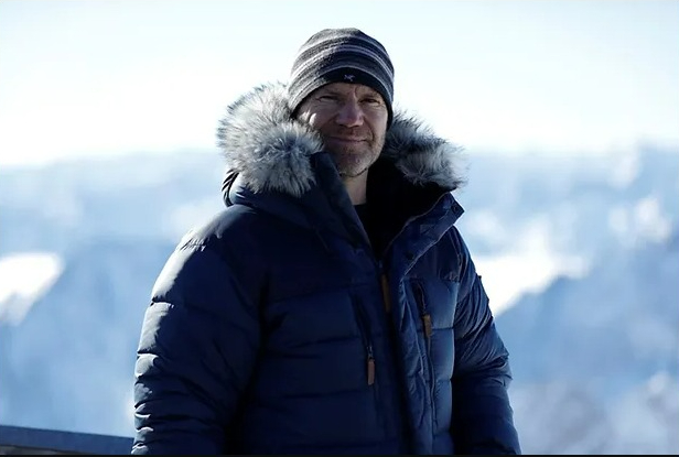 Man in winter coat and hat.