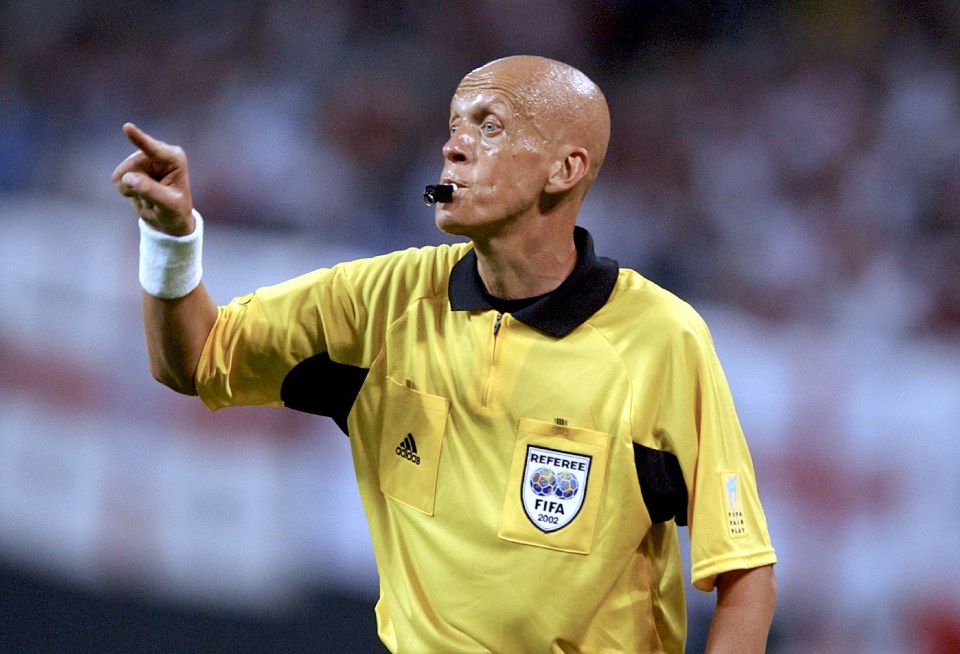 Pierluigi Collina, referee at a soccer game.