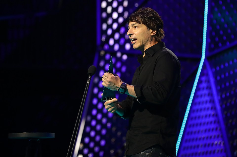 Arj Barker accepting an ARIA Award.