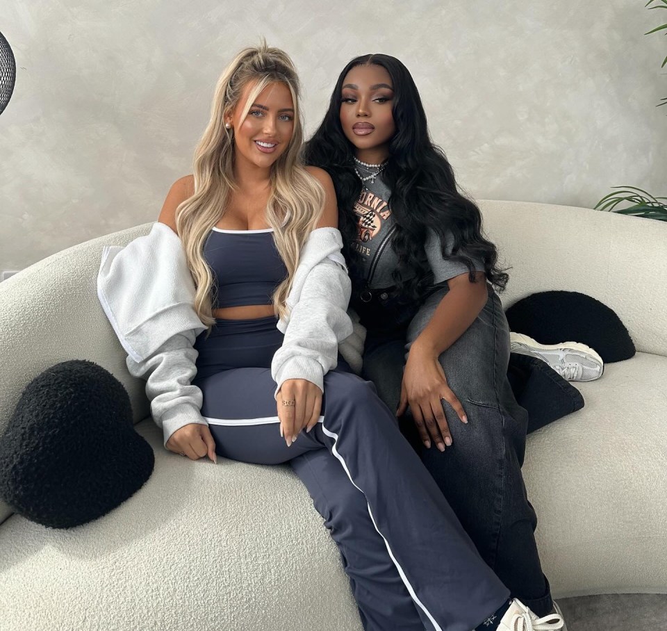 Jess Harding and Whitney Adebayo sitting together on a couch.