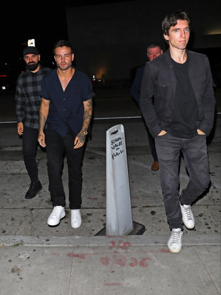 Liam Payne, his father, and a friend leaving Craig's restaurant.