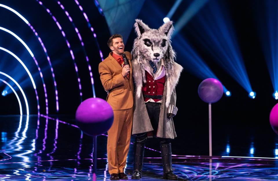 Joel Dommett and the Wolf contestant on The Masked Singer.