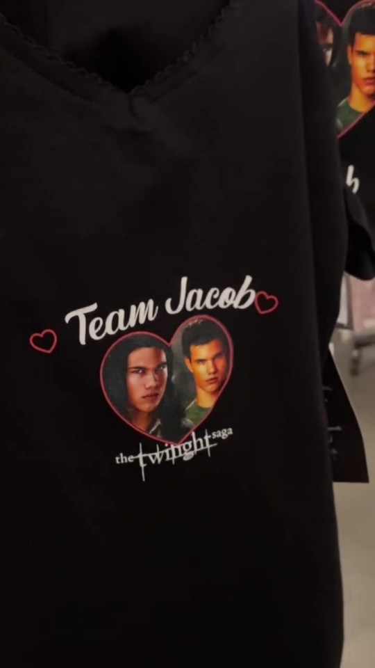 Black shirt with "Team Jacob" and images of Jacob and Edward from The Twilight Saga.