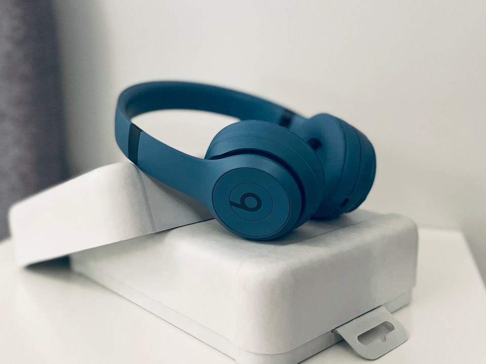 Beats Solo4 headphones in blue in their box.