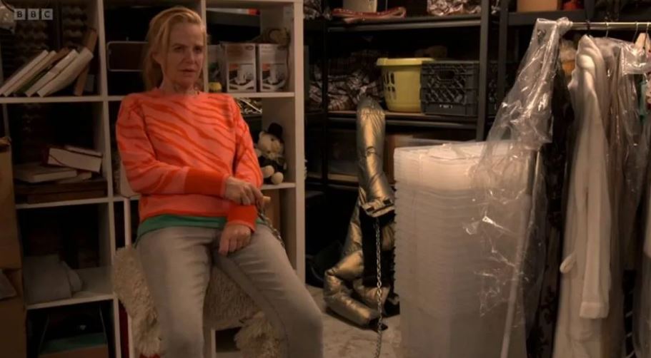 Bianca from EastEnders sitting in a storage unit.