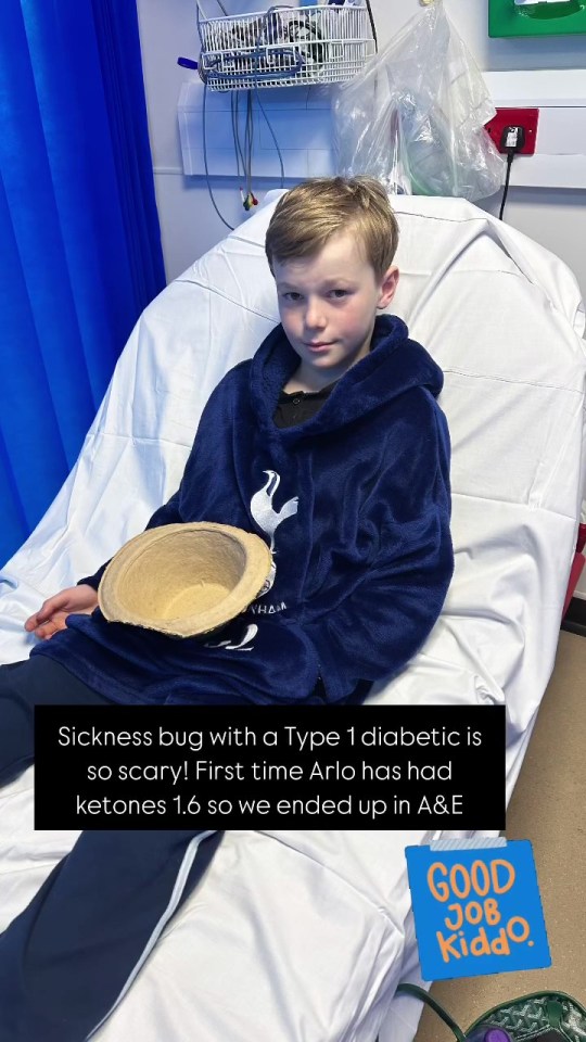 Boy in hospital gown holding a bowl.