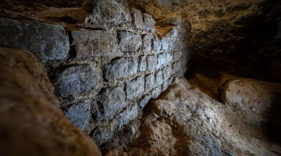 2000-year-old stone wall unearthed beneath an office basement.