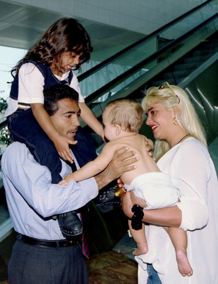 Romario with his family at an airport.