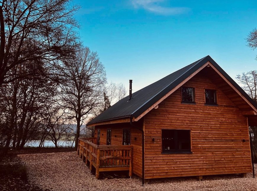 Wooden cabin with a deck.