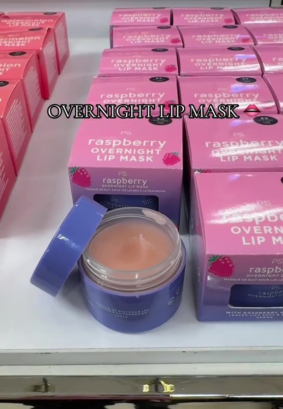 Raspberry overnight lip mask in a jar, surrounded by boxes of the same product.