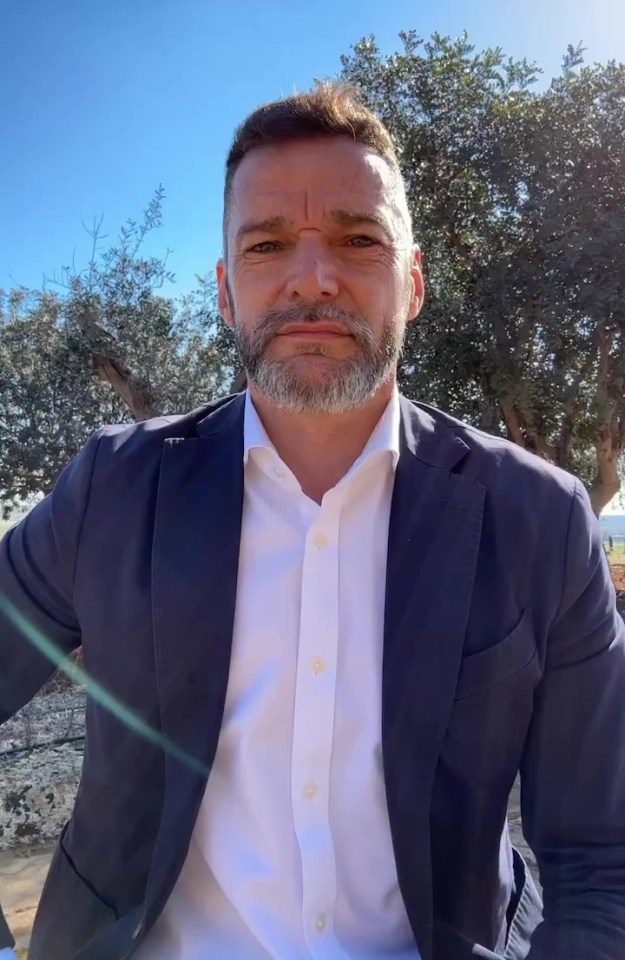 Fred Sirieix in a navy blazer and white shirt.