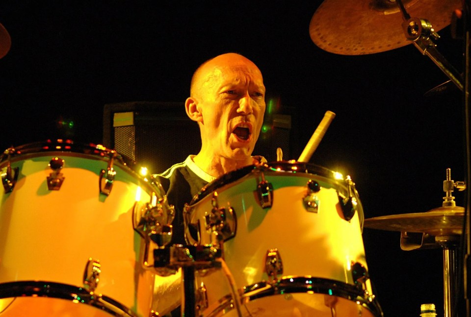 Rick Buckler of The Jam performing on drums.