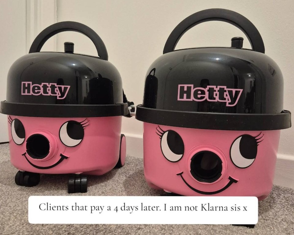 Two pink Hetty vacuum cleaners.