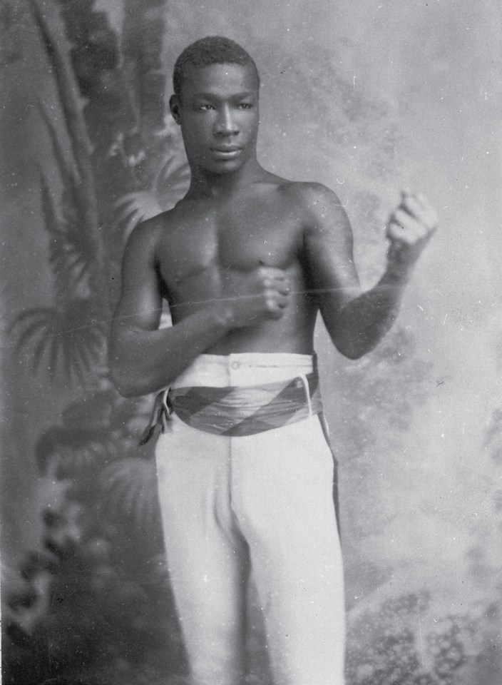 Black and white photo of a shirtless boxer.