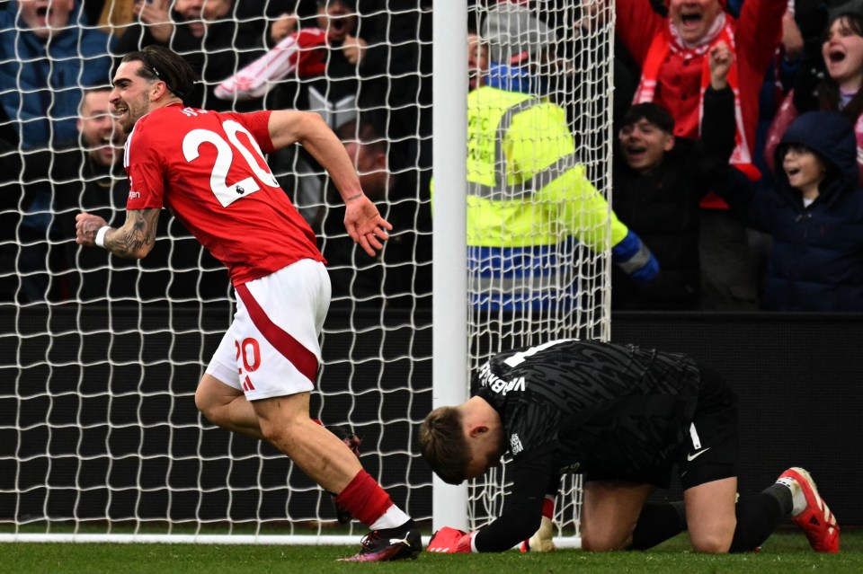 Soccer player #20 Jota Silva celebrates scoring a goal.