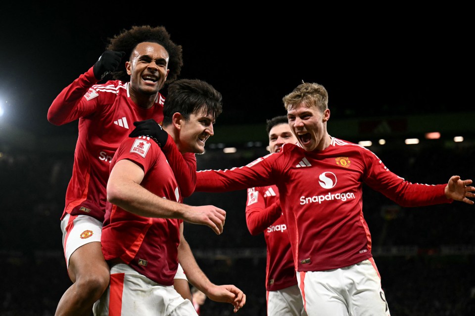 Manchester United players celebrating a goal.